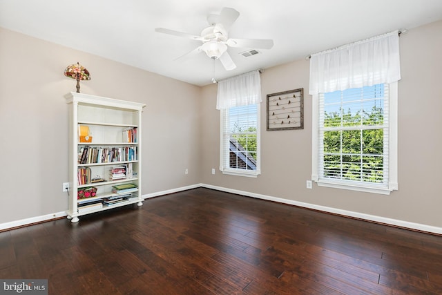 empty room featuring visible vents, baseboards, and a healthy amount of sunlight