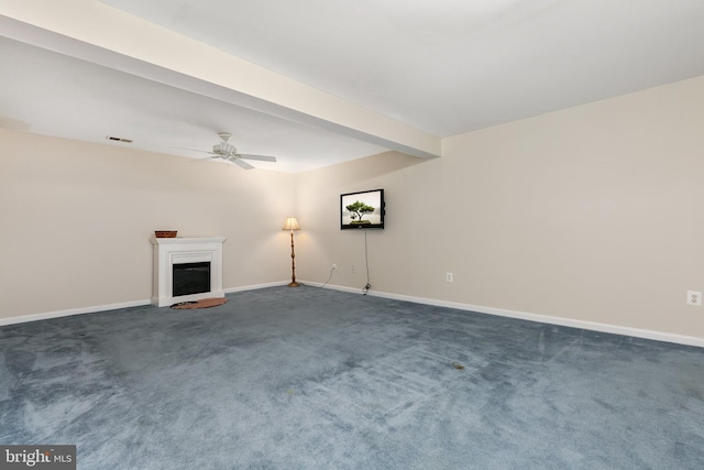 unfurnished living room featuring a fireplace, a ceiling fan, visible vents, dark colored carpet, and baseboards
