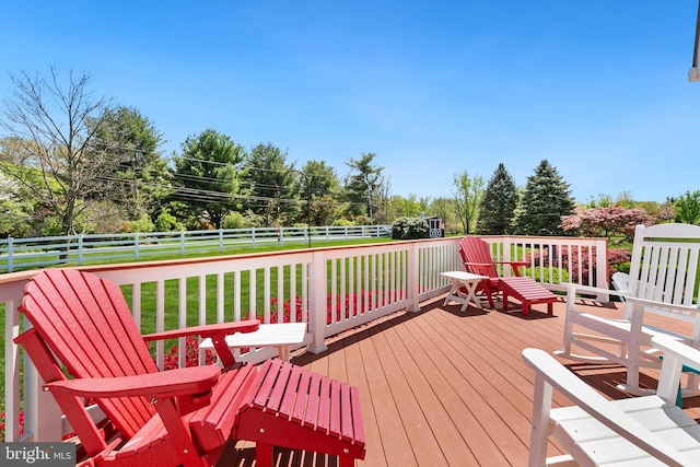 deck featuring a fenced backyard and a yard