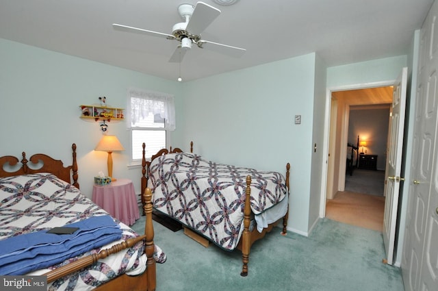 bedroom featuring a closet, a ceiling fan, and carpet floors