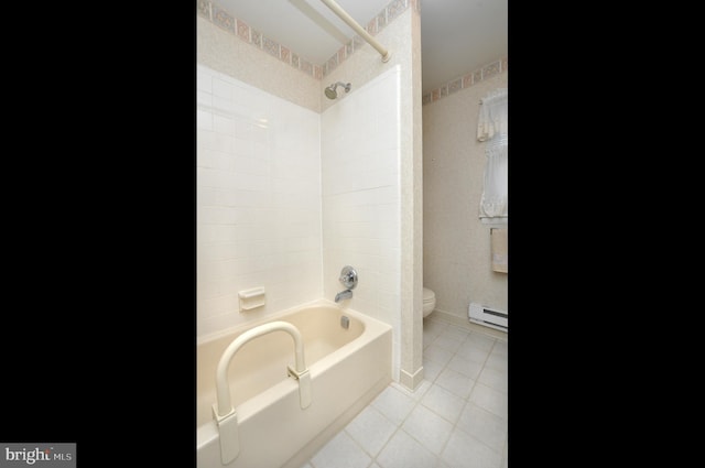 full bath featuring tile patterned floors, baseboard heating, toilet, and shower / tub combination