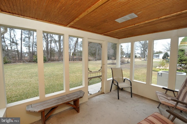 sunroom featuring wood ceiling