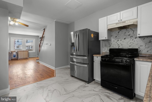 kitchen featuring black gas range, white cabinets, marble finish floor, under cabinet range hood, and stainless steel refrigerator with ice dispenser