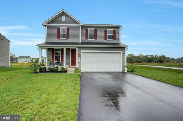 traditional-style home with aphalt driveway, covered porch, an attached garage, and a front lawn