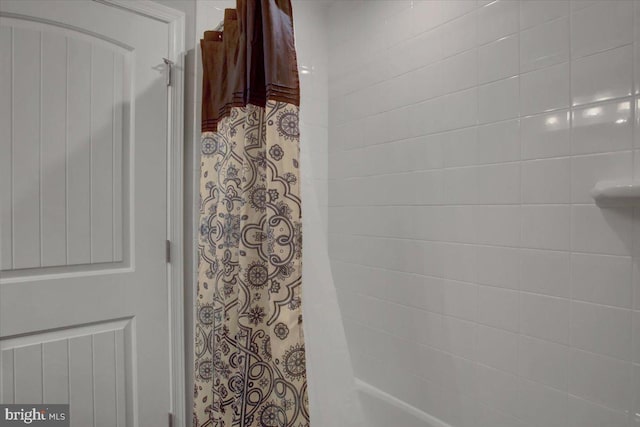 full bathroom with a shower with shower curtain