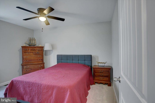 bedroom featuring carpet, a ceiling fan, and baseboards