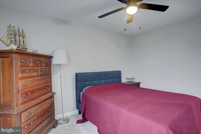 bedroom featuring a ceiling fan, carpet flooring, and baseboards