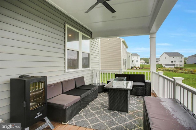 view of patio / terrace with a residential view, an outdoor living space, a ceiling fan, and a wooden deck