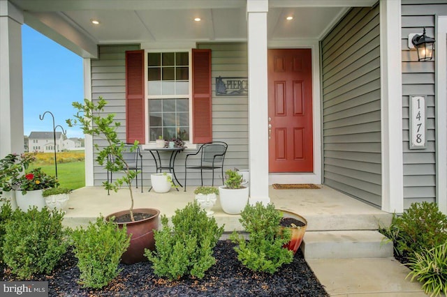 property entrance featuring a porch