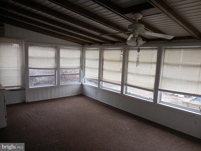 unfurnished sunroom with lofted ceiling with beams, ceiling fan, and a wealth of natural light