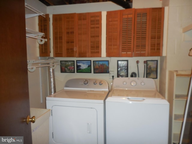 laundry area featuring washing machine and clothes dryer