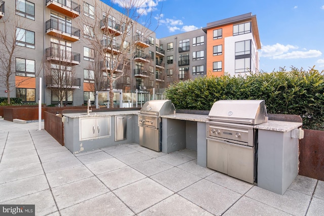 view of patio featuring area for grilling and an outdoor kitchen