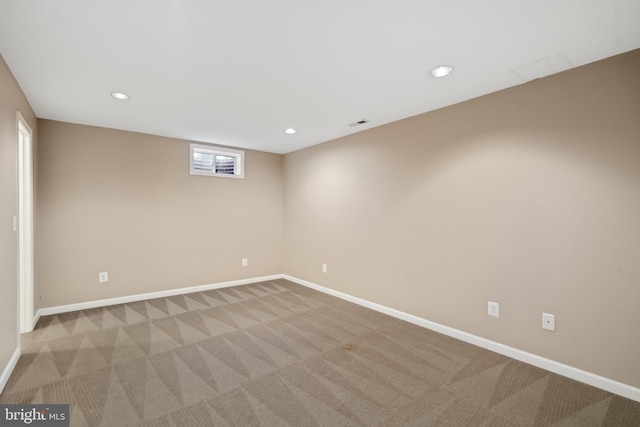 below grade area featuring visible vents, recessed lighting, baseboards, and carpet floors