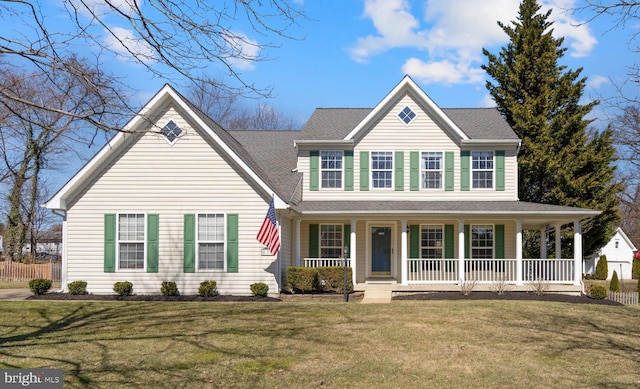 view of front of home with a front lawn, a porch, and roof with shingles