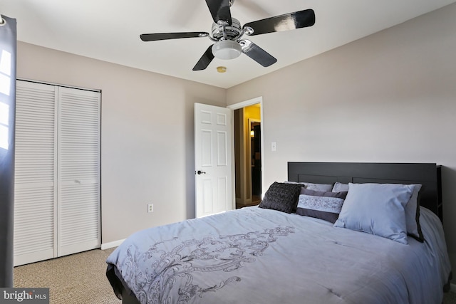 bedroom with a closet, carpet flooring, a ceiling fan, and baseboards