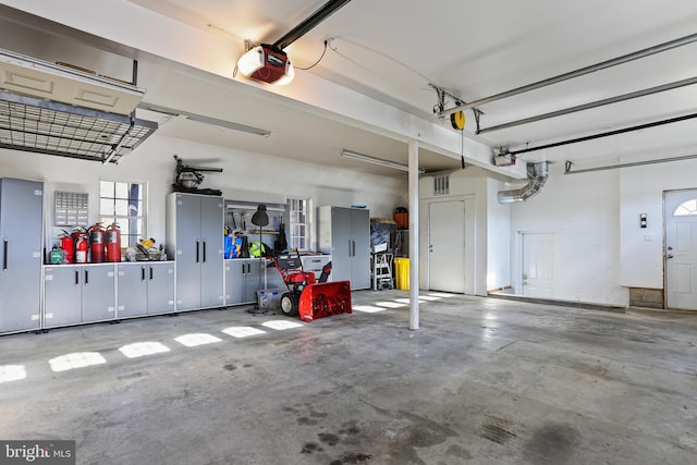 garage featuring a garage door opener