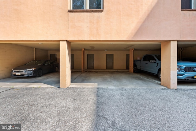 view of car parking featuring a parking deck