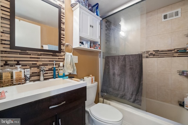 bathroom featuring visible vents, toilet, tasteful backsplash, bathing tub / shower combination, and vanity