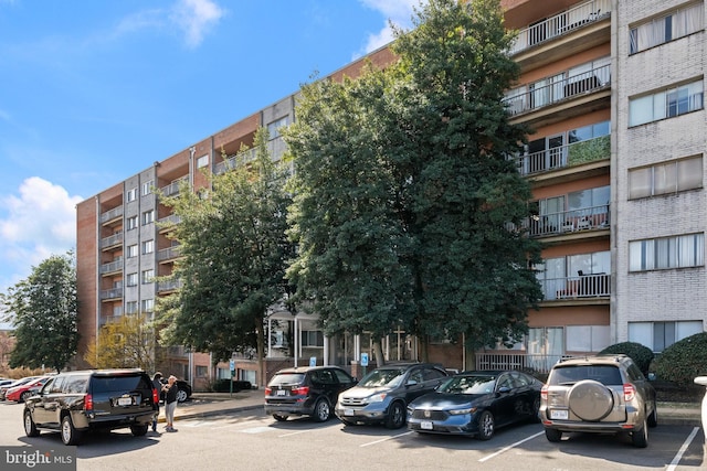 view of property featuring uncovered parking