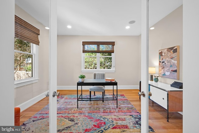 office space with wood finished floors and french doors