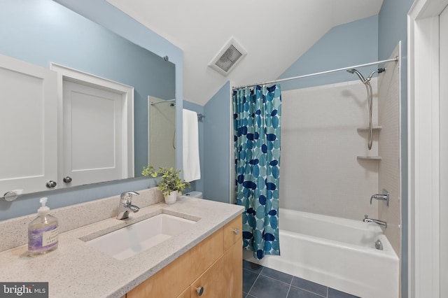 full bathroom with lofted ceiling, visible vents, shower / bath combo, vanity, and tile patterned floors