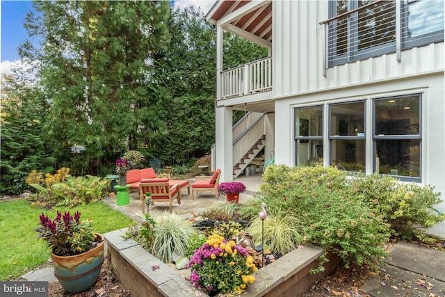 view of yard with a patio area, outdoor lounge area, and stairway