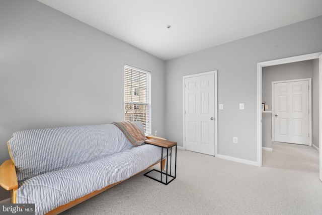 living area with carpet and baseboards