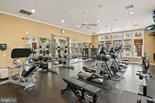 workout area featuring baseboards, visible vents, crown molding, and recessed lighting