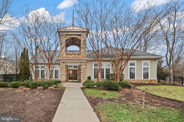 view of building exterior with fence