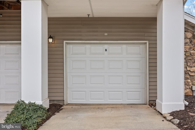 garage with concrete driveway