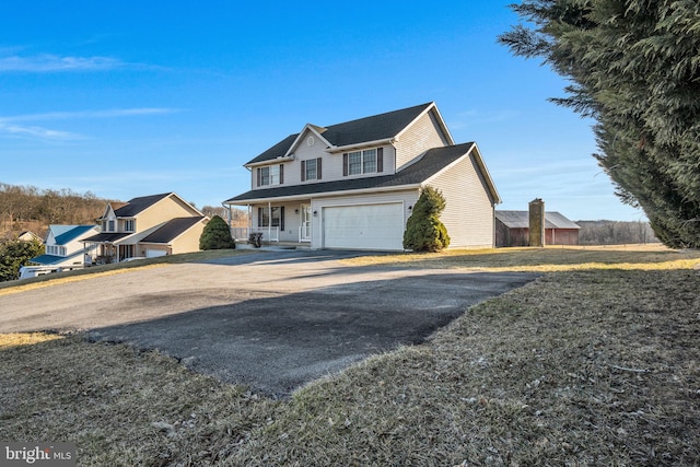 traditional home with driveway and a garage