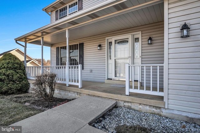 property entrance with covered porch