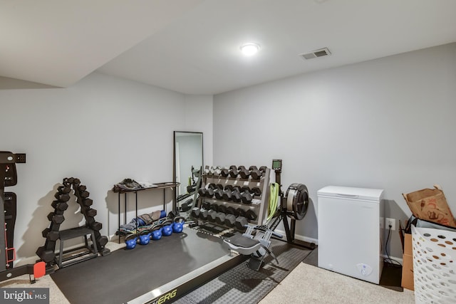 exercise area featuring baseboards and visible vents