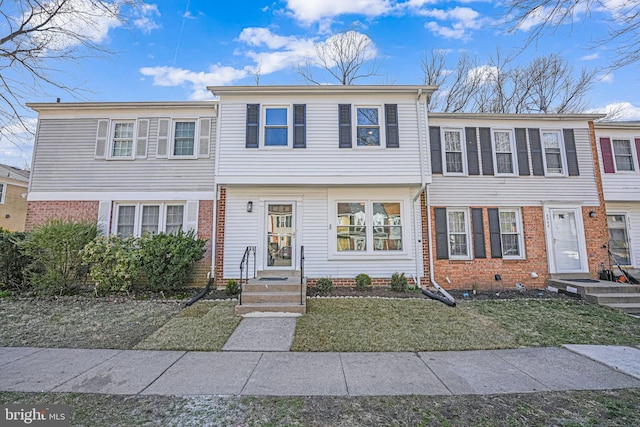 view of front of house featuring brick siding