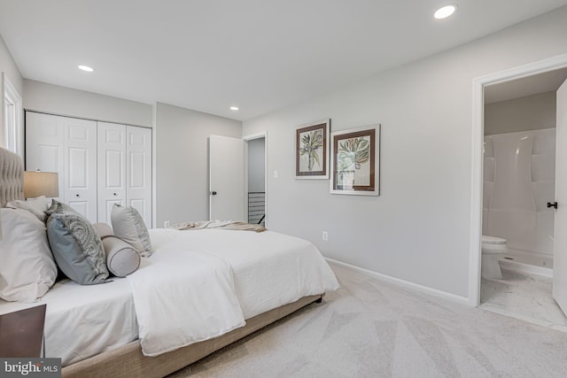 bedroom featuring baseboards, carpet flooring, recessed lighting, a closet, and ensuite bath