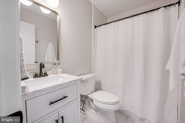 bathroom featuring vanity, toilet, and marble finish floor