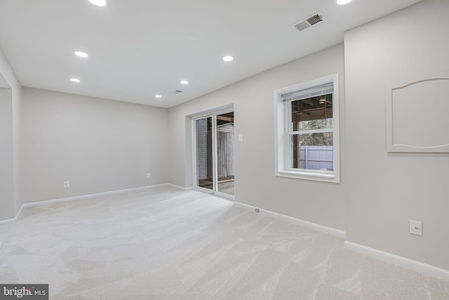 unfurnished bedroom with visible vents, baseboards, recessed lighting, access to outside, and light colored carpet