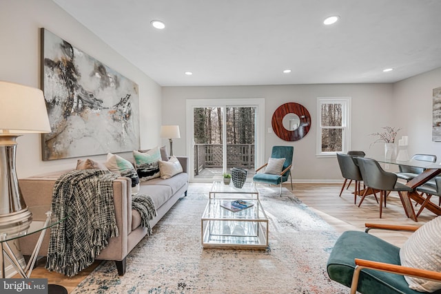 living room featuring recessed lighting, wood finished floors, and baseboards