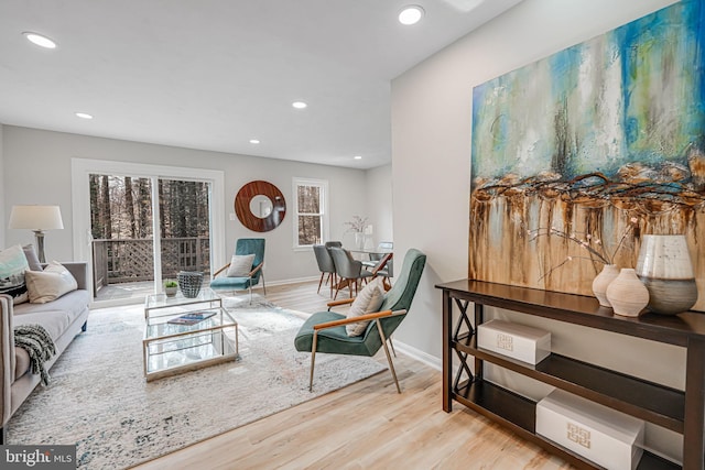 living room featuring recessed lighting, wood finished floors, and baseboards