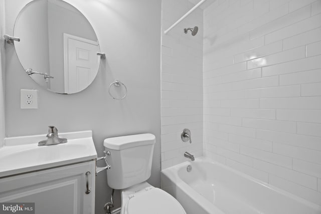 bathroom with shower / bath combination, vanity, and toilet