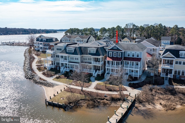 birds eye view of property with a residential view and a water view