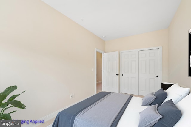 bedroom featuring a closet and baseboards