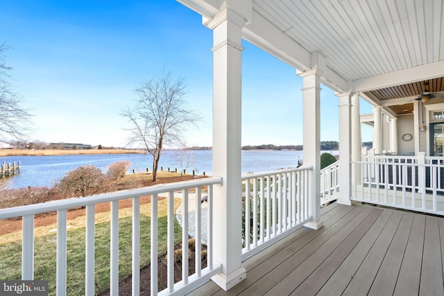 wooden terrace with a water view