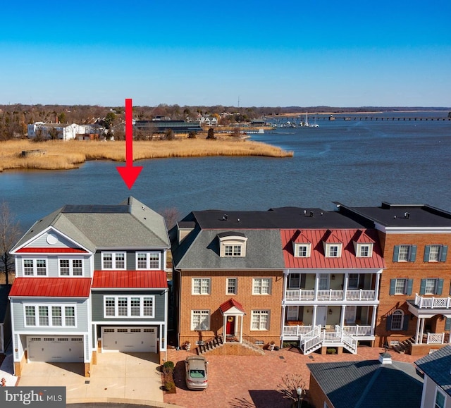 birds eye view of property featuring a water view