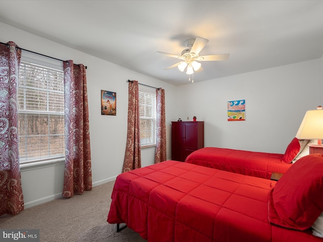 bedroom with carpet, ceiling fan, and baseboards