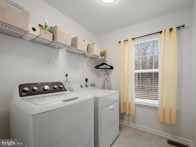 laundry area featuring plenty of natural light, laundry area, independent washer and dryer, and visible vents