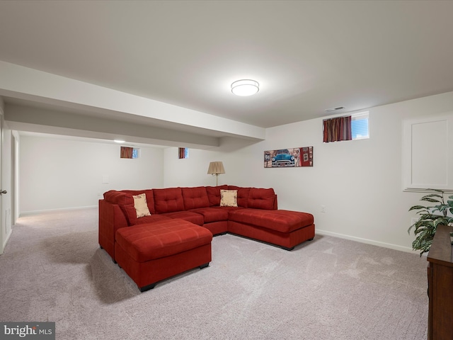 carpeted living room with visible vents and baseboards