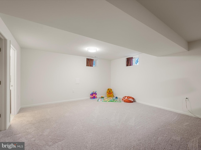 playroom with carpet floors and baseboards