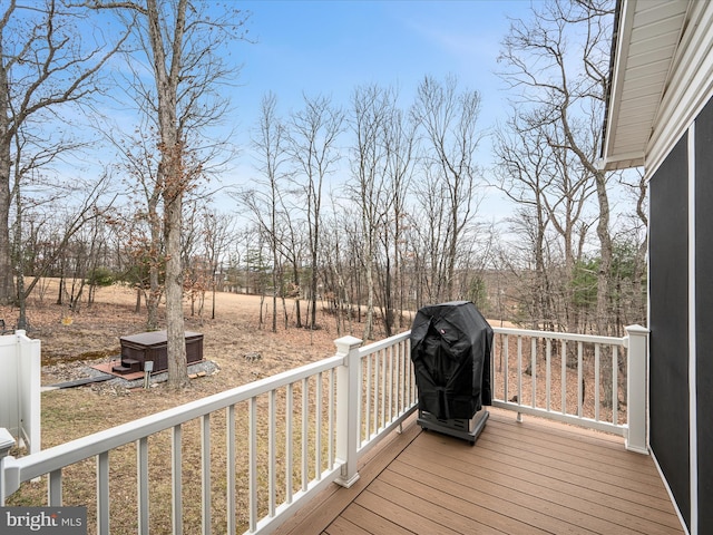 wooden terrace featuring grilling area