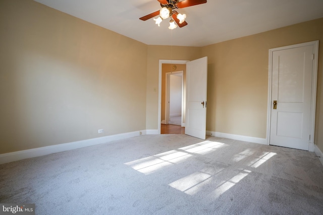 unfurnished bedroom featuring ceiling fan, carpet floors, and baseboards